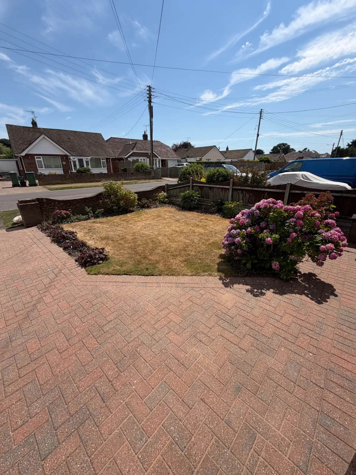Cleaned block-paved driveway in front of a house